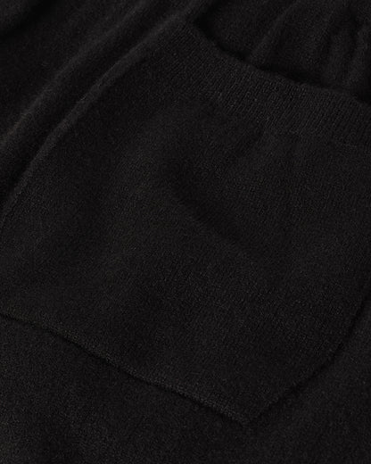 Model wearing Johnstons of Elgin Men's Knitwear Black Kirk Cashmere Joggers KBP00948SA7099