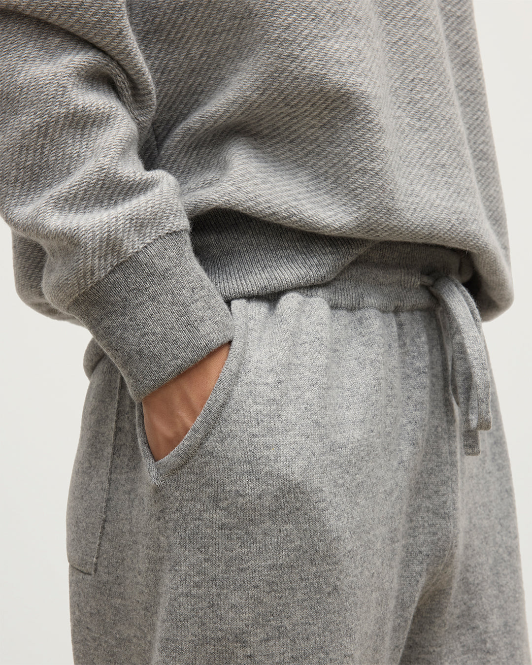 MALE MODEL WEARS JOHNSTONS OF ELGIN MENS KIRK SWEATPANTS LIGHT GREY 97% CASHMERE 3% POLYESTER KBP00948HA0308