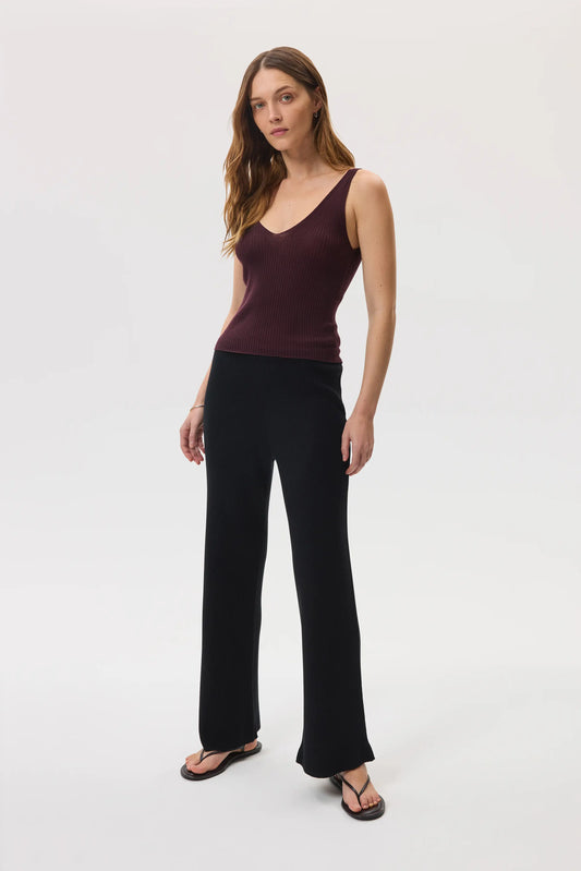 Johnstons of Elgin SS25 Women's Knitwear Black Ribbed Merino Wide Leg Trousers worn with our superfine cashmere ribbed vest top in rosewood KDP00746SA7190