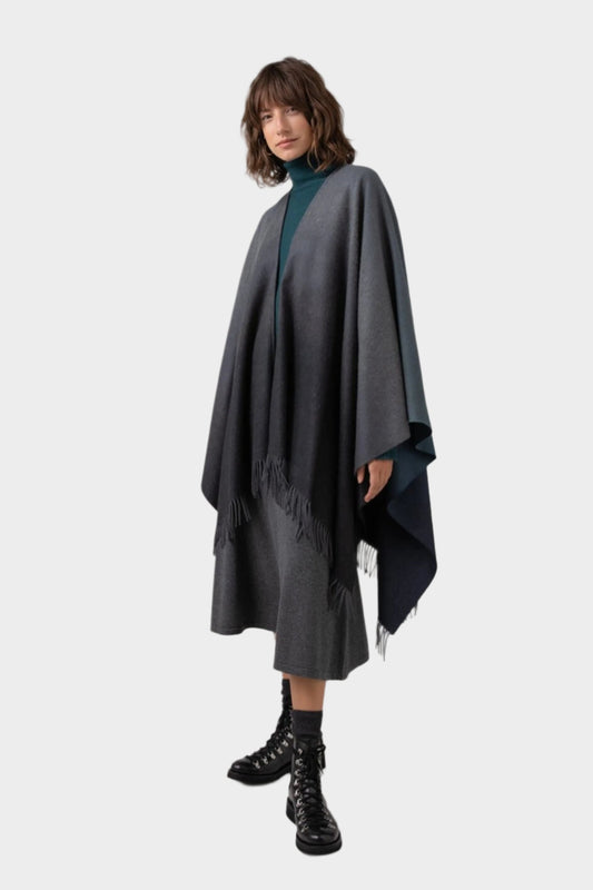 Johnstons of Elgin Ombre Cape in Navy & Back worn by model against a grey background TA000360RU7302ONE