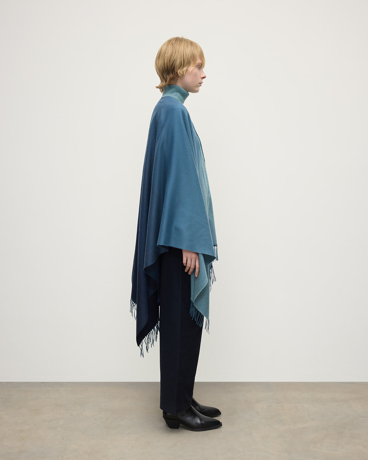 Model wears Johnstons of Elgin AW25 Woven Accessories Seascape & Navy Blue Ombré Cashmere Cape Side View TA000360RU7686ONE