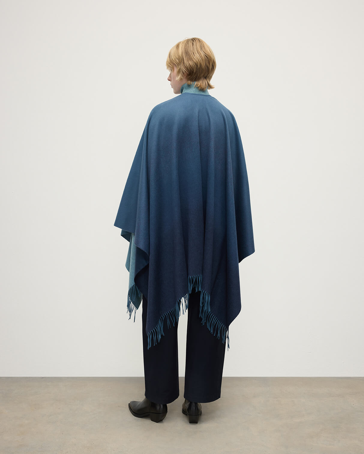 Model wears Johnstons of Elgin AW25 Woven Accessories Seascape & Navy Blue Ombré Cashmere Cape Back View TA000360RU7686ONE