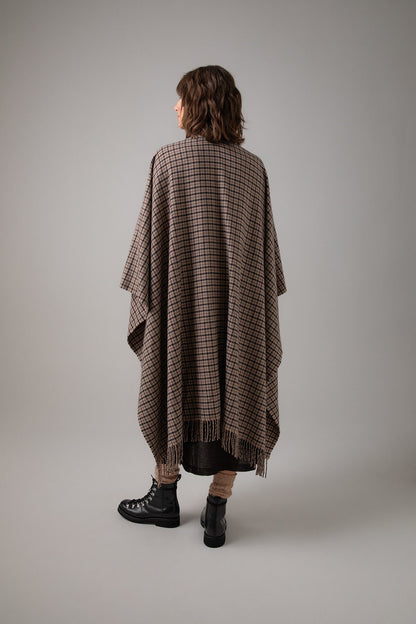 Back of Johnstons of Elgin Cashmere Poncho Cape in Brown gunclub on a grey background TA000501RU7299ONE