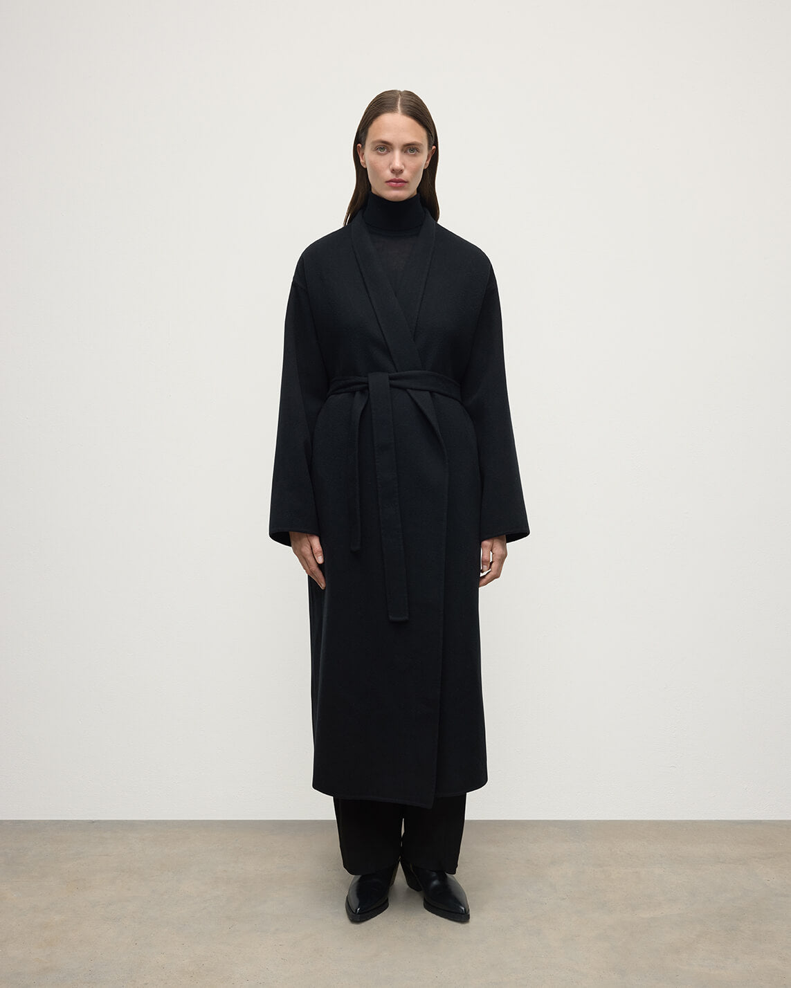 Model wears Johnstons of Elgin AW25 Women's Tailoring Black Black Cashmere Wrap Coat Front View TA000621RU6432