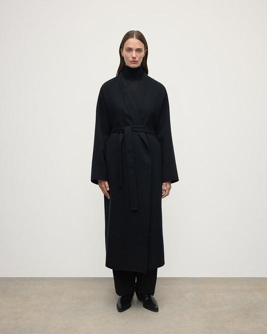 Model wears Johnstons of Elgin AW25 Women's Tailoring Black Black Cashmere Wrap Coat Front View TA000621RU6432