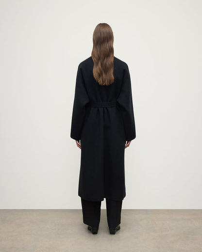 Model wears Johnstons of Elgin AW25 Women's Tailoring Black Black Cashmere Wrap Coat Back View TA000621RU6432