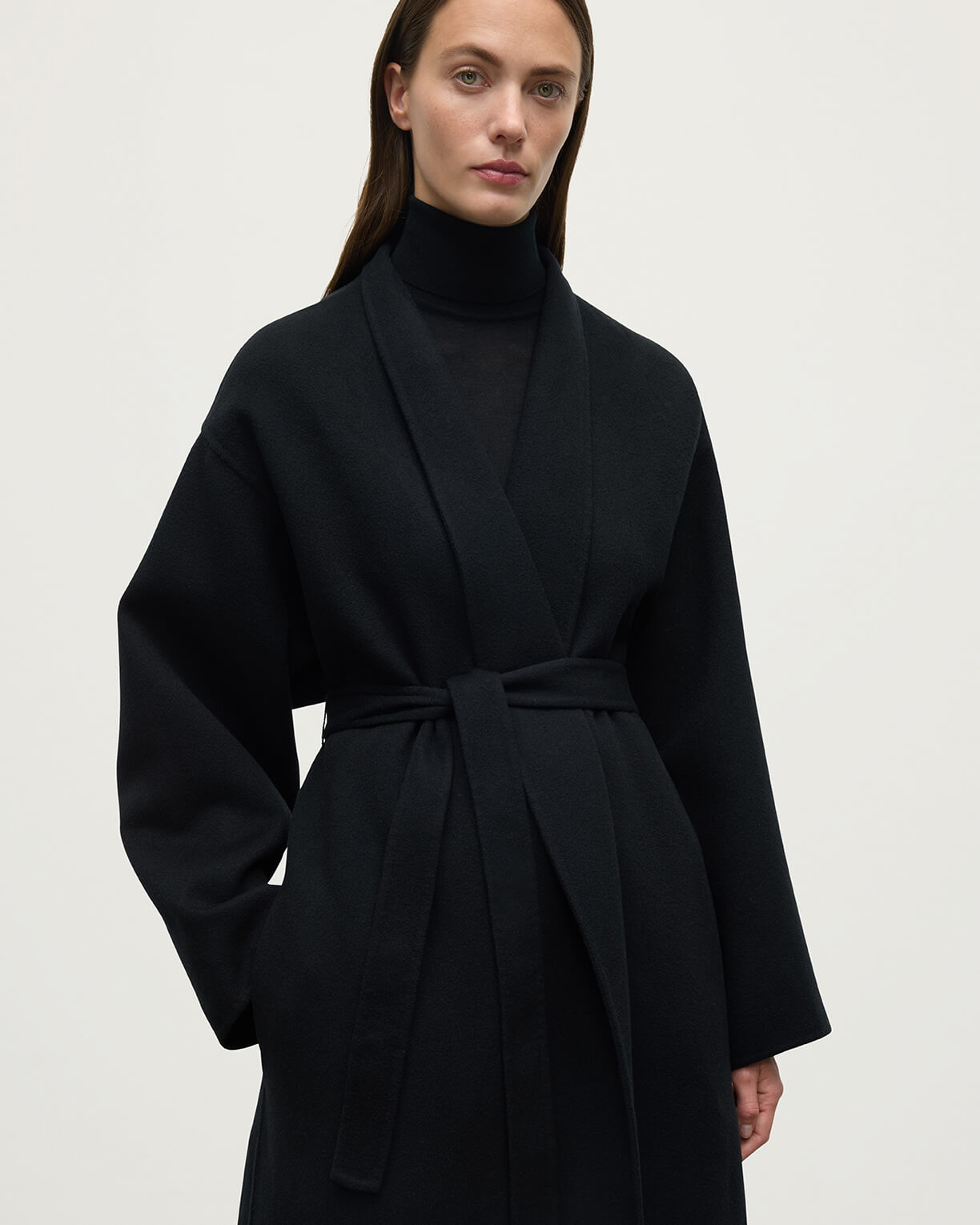 Model wears Johnstons of Elgin Women's Tailoring Black Black Cashmere Wrap Coat Front View TA000621RU6432