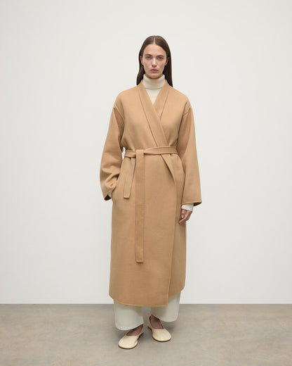 Model wears Johnstons of Elgin Women's Tailoring Camel Camel Cashmere Wrap Coat Front View  TA000621RU7397