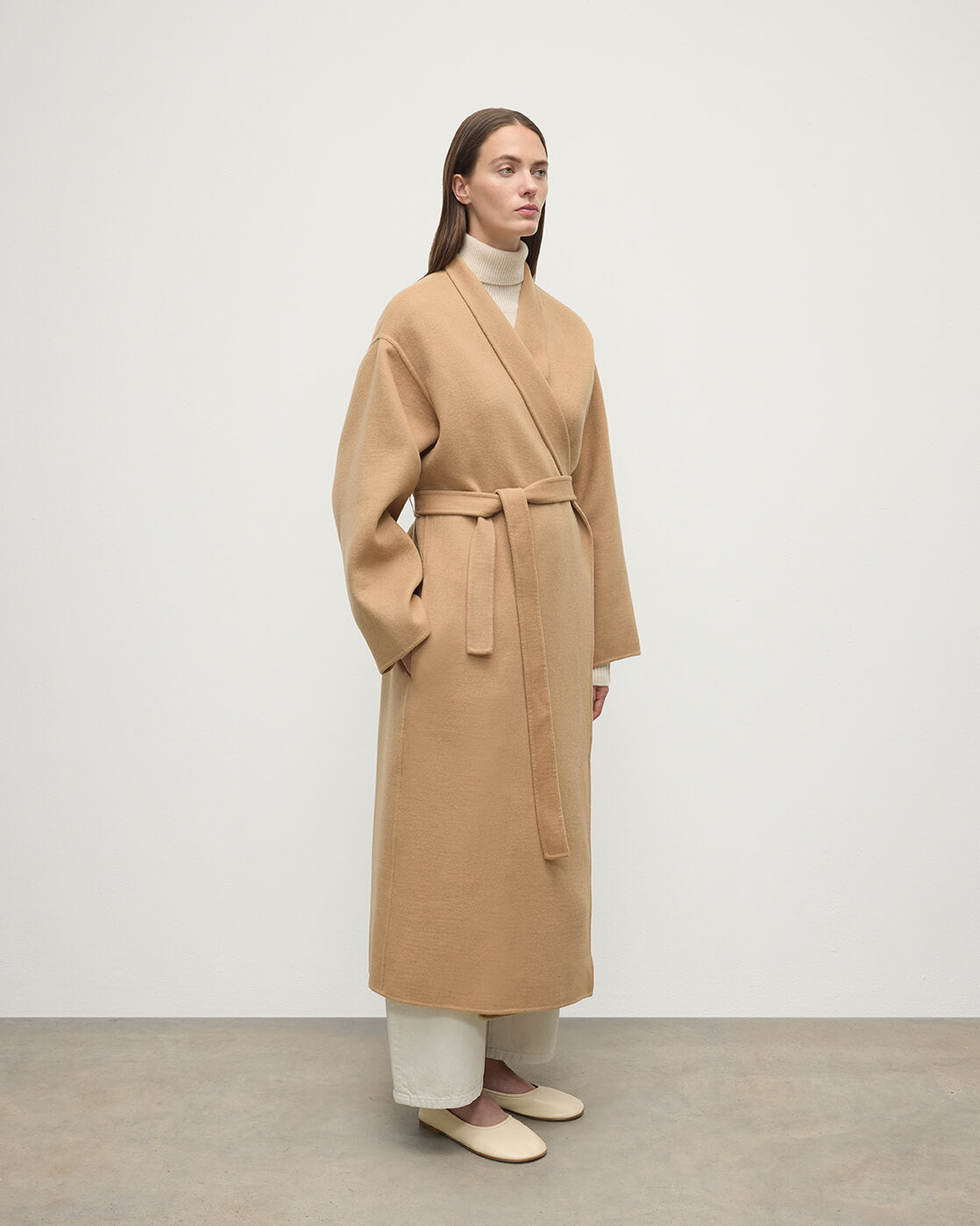 Model wears Johnstons of Elgin AW25 Women's Tailoring Camel Camel Cashmere Wrap Coat Side View  TA000621RU7397