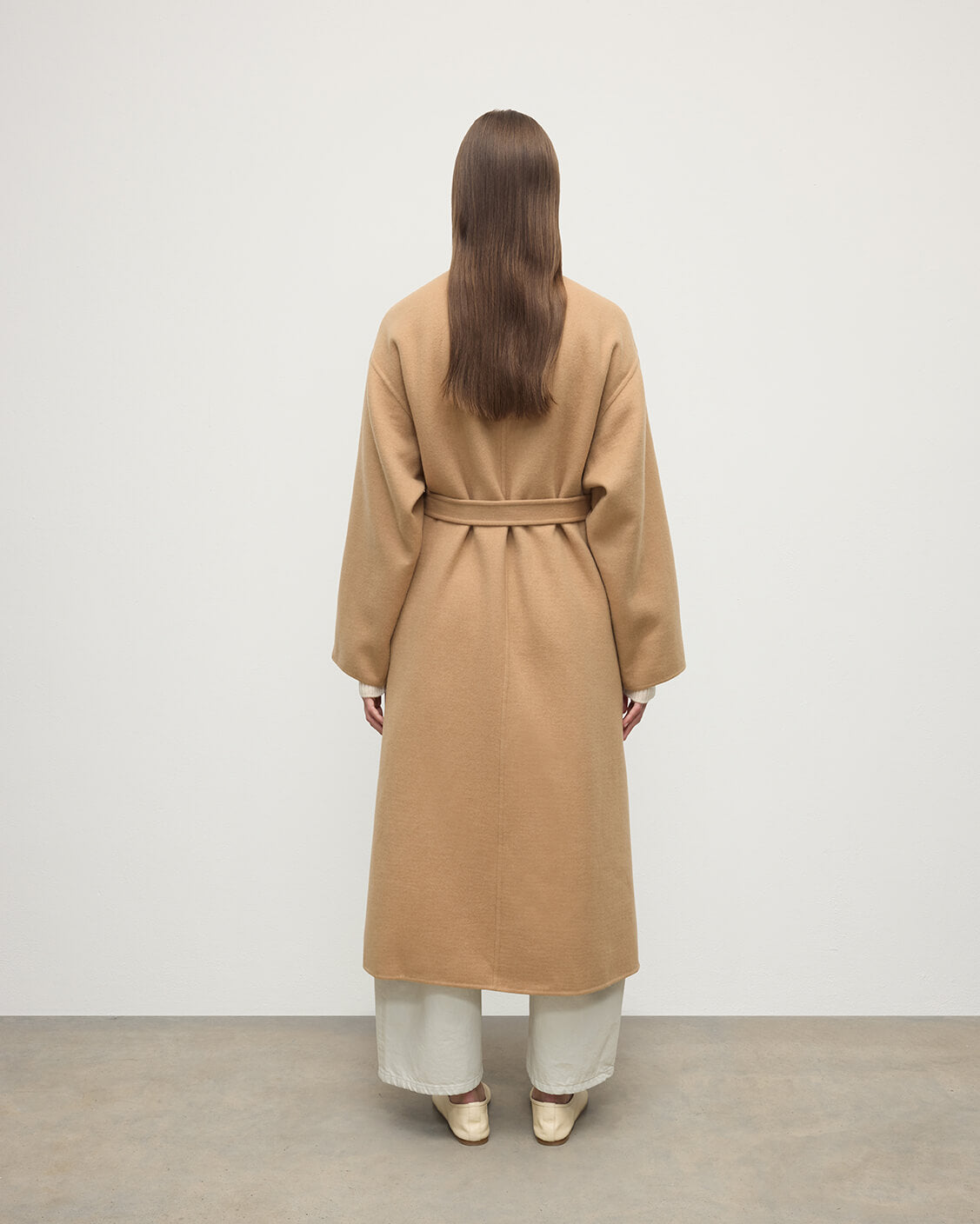 Model wears Johnstons of Elgin AW25 Women's Tailoring Camel Camel Cashmere Wrap Coat Back View  TA000621RU7397