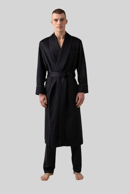 Johnstons of Elgin’s Men's Navy Cashmere Dressing Gown with Silk Lining on model wearing navy bottoms on a grey background TA000472RU65880