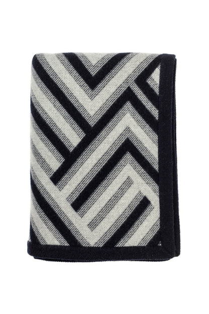 Johnstons of Elgin Merino Cashmere Blend Chevron Throw in Navy & Silver folded on a white background TB000470RU6997ONE