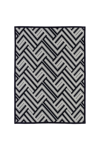 Johnstons of Elgin Merino Cashmere Blend Chevron Throw in Navy & Silver flat on a white background TB000470RU6997ONE