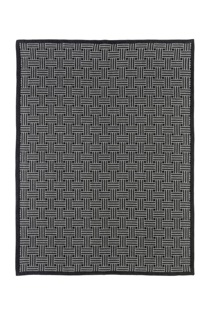 Johnstons of Elgin Merino Cashmere Blend Chevron Throw in Grey & Charcoal folded on a white background TB000470RU6998ONE