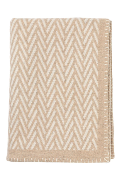 Johnstons of Elgin Merino Cashmere Blend Chevron Throw in Natural & White folded on a white background TB000500RU6971ONE