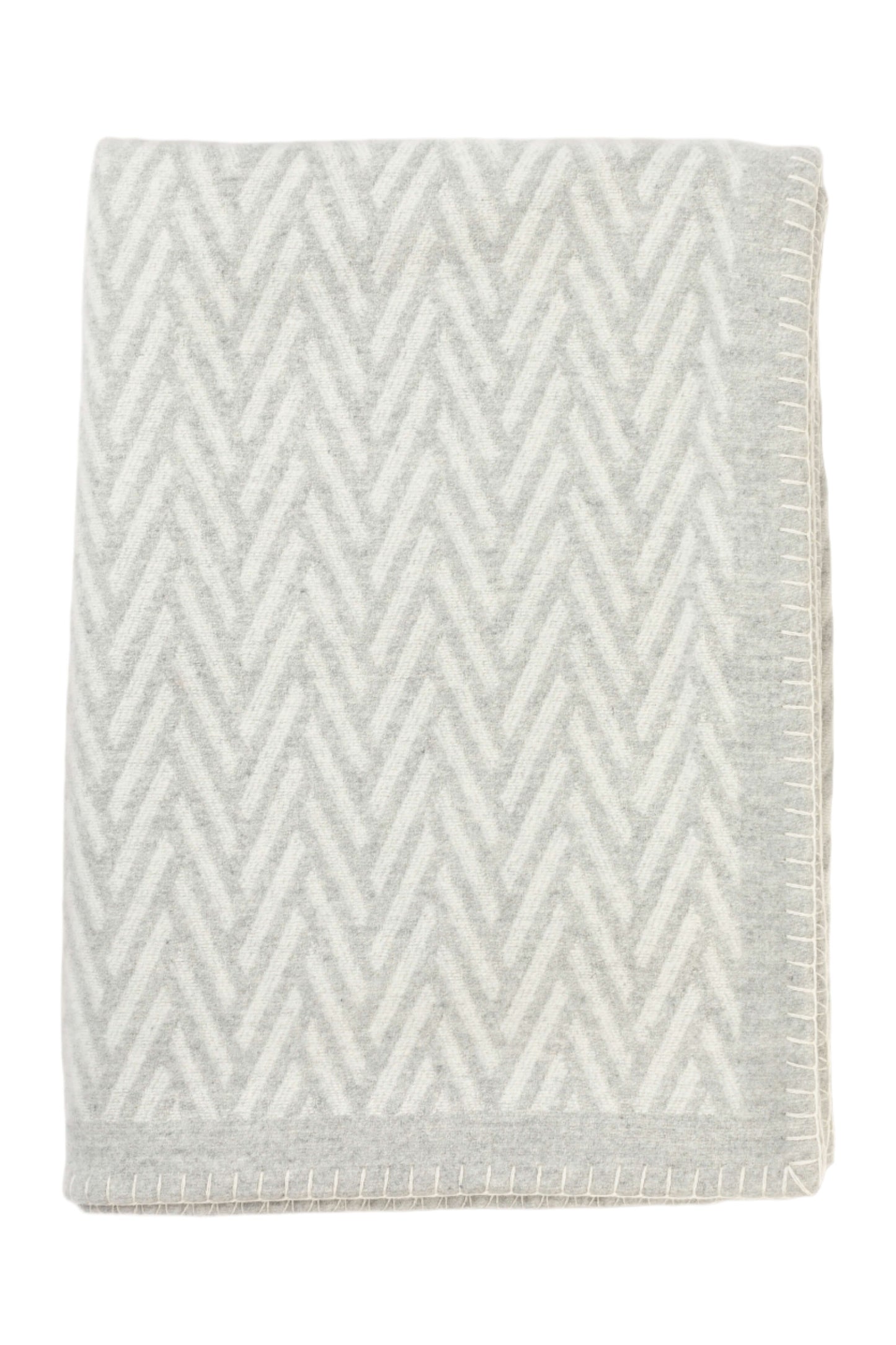 Johnstons of Elgin Merino Cashmere Blend Chevron Throw in Silver & White folded on a white background TB000500RU6972ONE