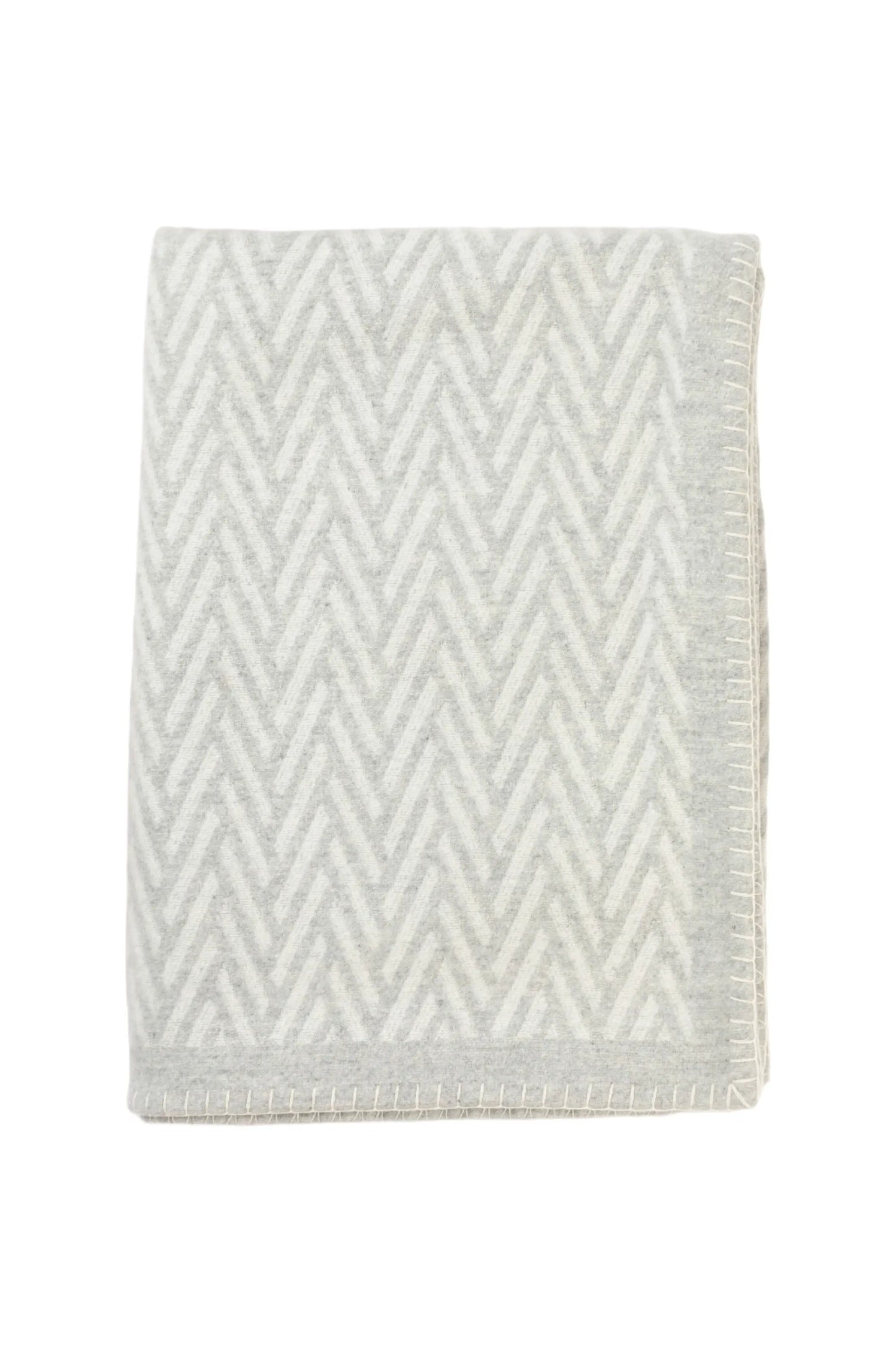 Johnstons of Elgin Merino Cashmere Blend Chevron Throw in Silver & White folded on a white background TB000500RU6972ONE