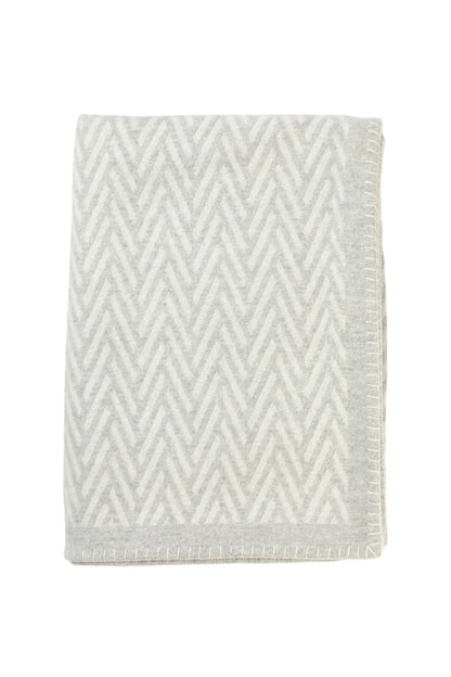 Johnstons of Elgin Merino Cashmere Blend Chevron Throw in Silver & White folded on a white background TB000500RU6972ONE