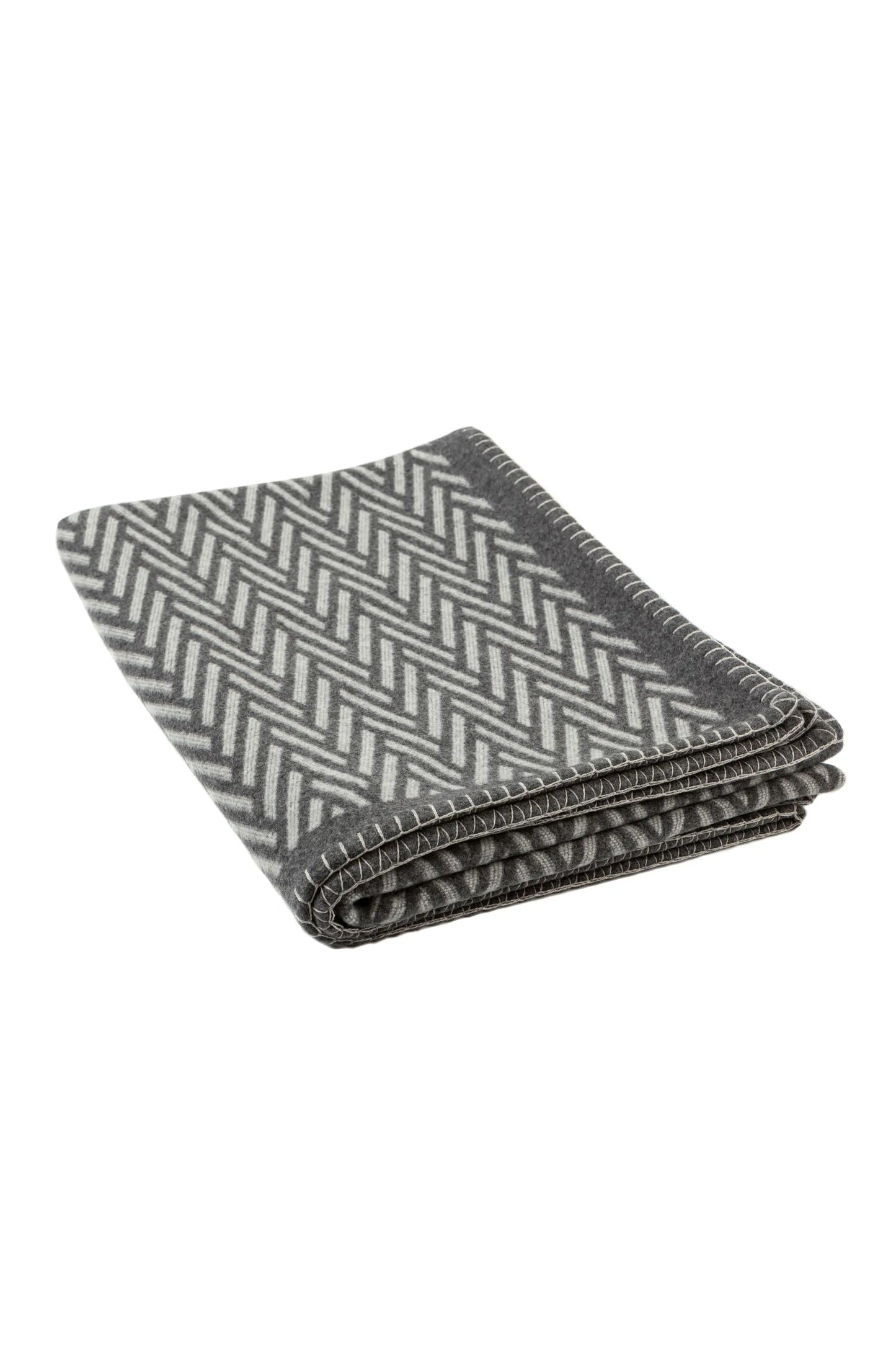 Johnstons of Elgin’s Grey Herringbone Blanket Stitch Throw on a white background TB000500RU6973ONE