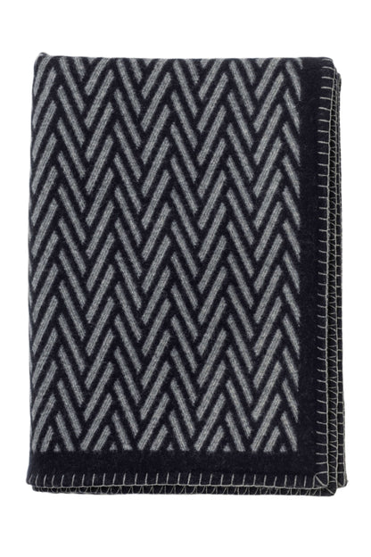 Johnstons of Elgin Merino Cashmere Blend Chevron Throw in Navy & Grey folded on a white background TB000500RU6974ONE