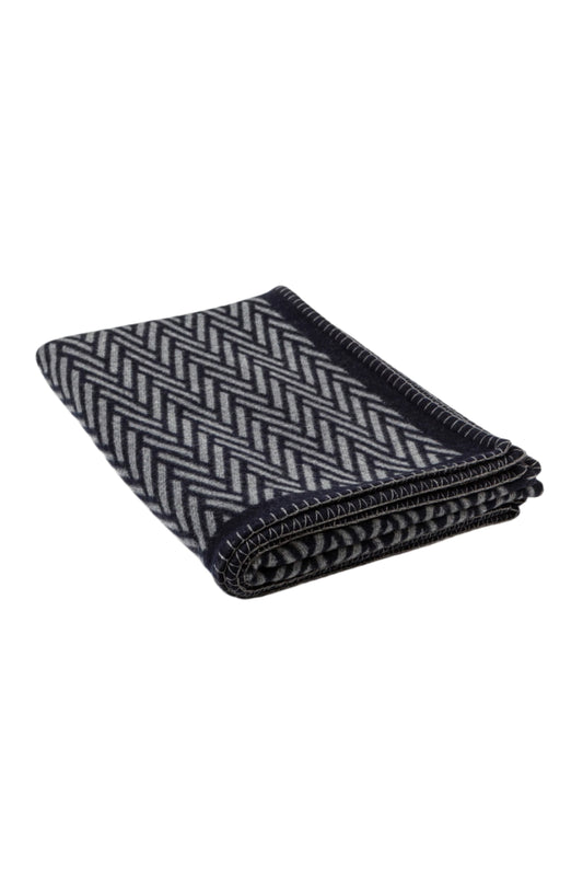 Johnstons of Elgin Merino Cashmere Blend Chevron Throw in Navy & Grey folded on a white background TB000500RU6974ONE