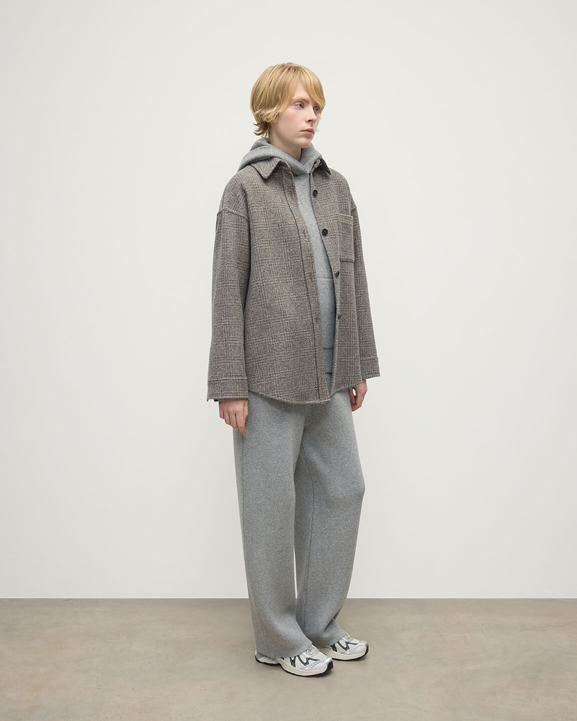 Model wearing Johnstons of Elgin AW25 Women's Tailoring Ash Small Glen Urquhart Glen Urquhart Check Oversized Shirt Side View TB000754RU7675