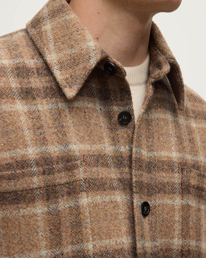 Model wears Johnstons of Elgin AW25 Men's Tailoring Vicuna Tweed Check Cashmere Wool Blend Brown Overshirt details of buttons and collar TB000755RU7683