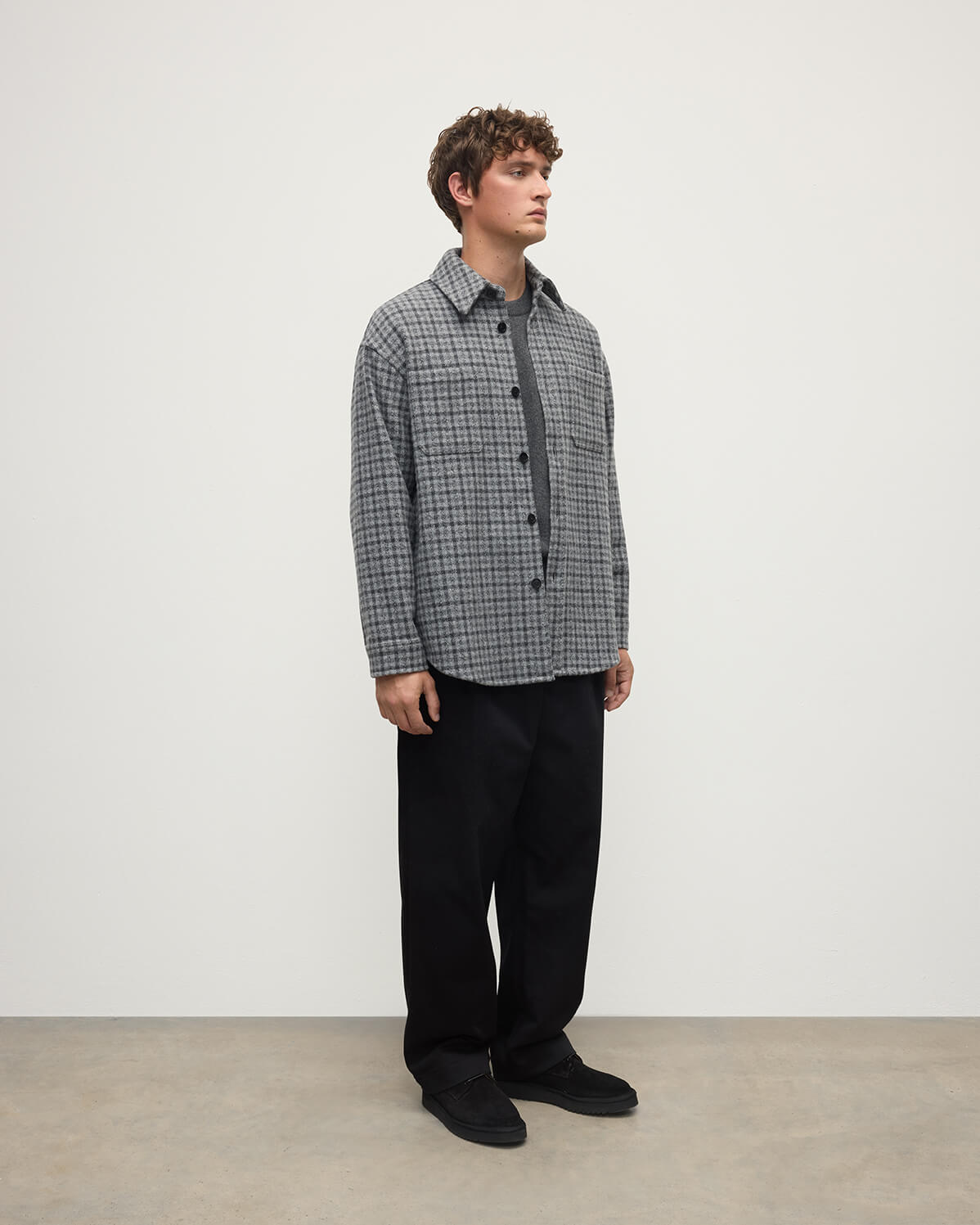 Side view of a model wearing Johnstons of Elgin AW25 Men's Tailoring Grey Classic Gunclub Cashmere Wool Blend Grey Overshirt TB000755RU7684