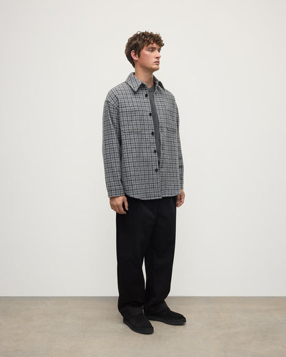 Side view of a model wearing Johnstons of Elgin AW25 Men's Tailoring Grey Classic Gunclub Cashmere Wool Blend Grey Overshirt TB000755RU7684