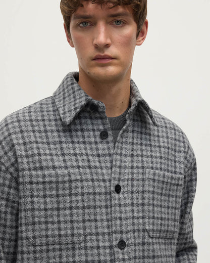 Close up of a model wearing Johnstons of Elgin AW25 Men's Tailoring Grey Classic Gunclub Cashmere Wool Blend Grey Overshirt TB000755RU7684
