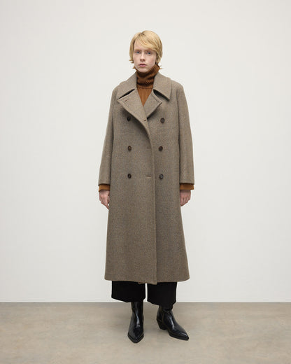 Model wears Johnstons of Elgin AW25 Women's Tailoring Partridge Tweed Herringbone The Great Coat in Brown Front View TD000438RU7671