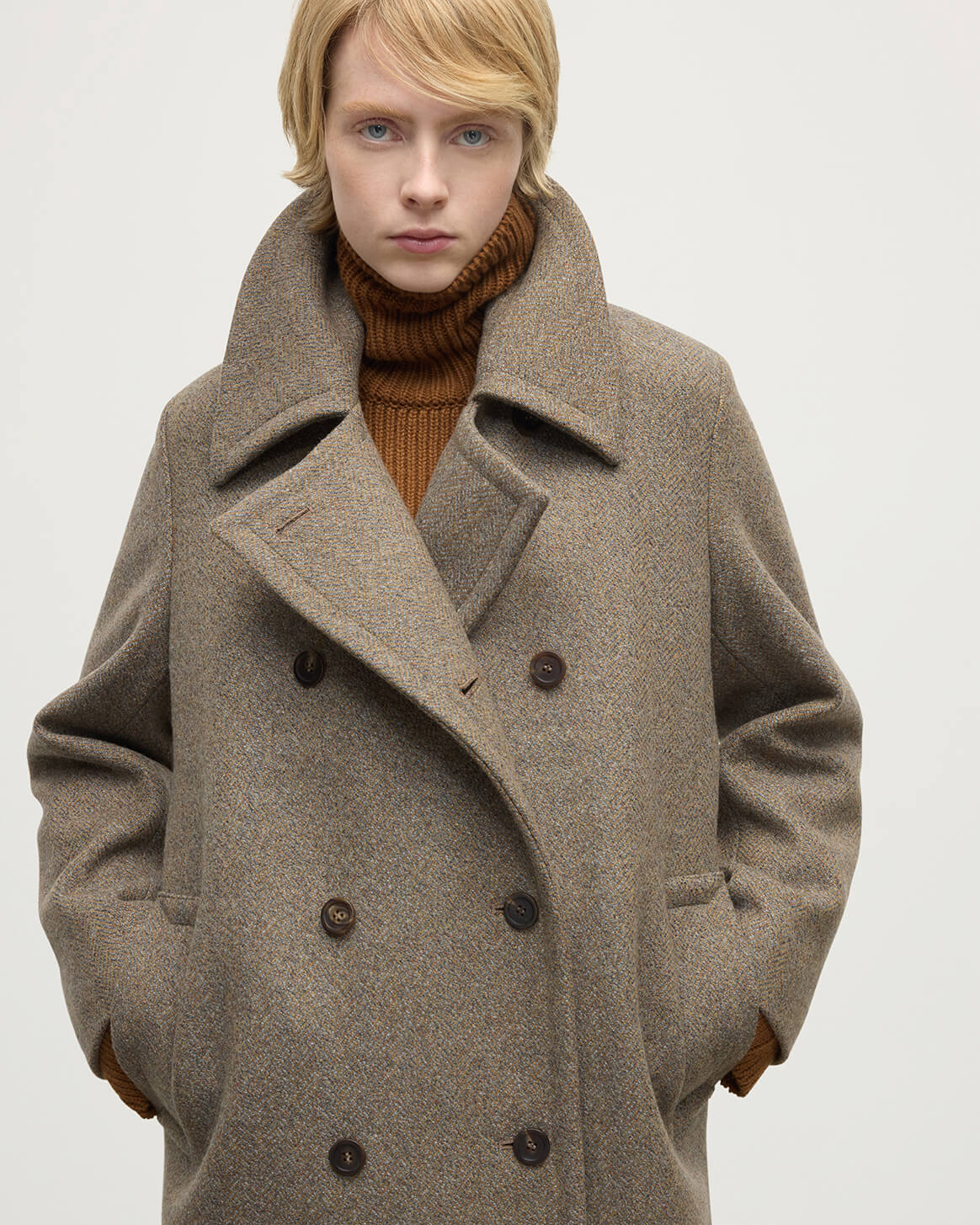 Model wears Johnstons of Elgin  Women's Tailoring Partridge Tweed Herringbone The Great Coat in Brown Front View TD000438RU7671