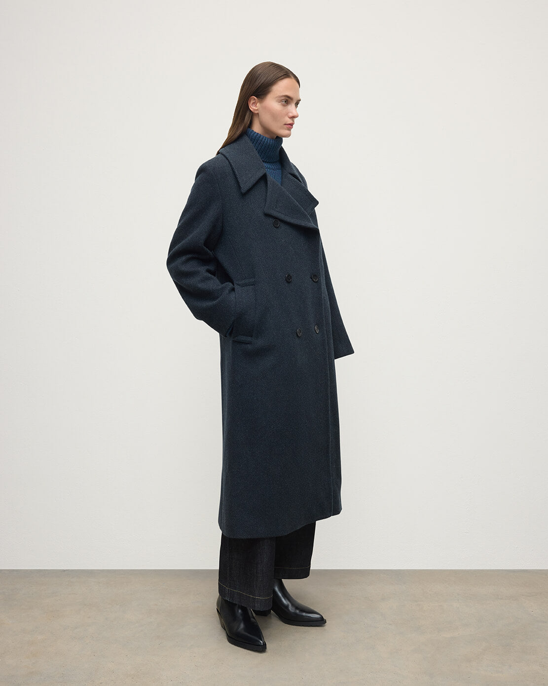 Model wearing Johnstons of Elgin AW25 Women's Tailoring Bottle Dark Twill The Great Coat in Green Side View TD000438RU7672