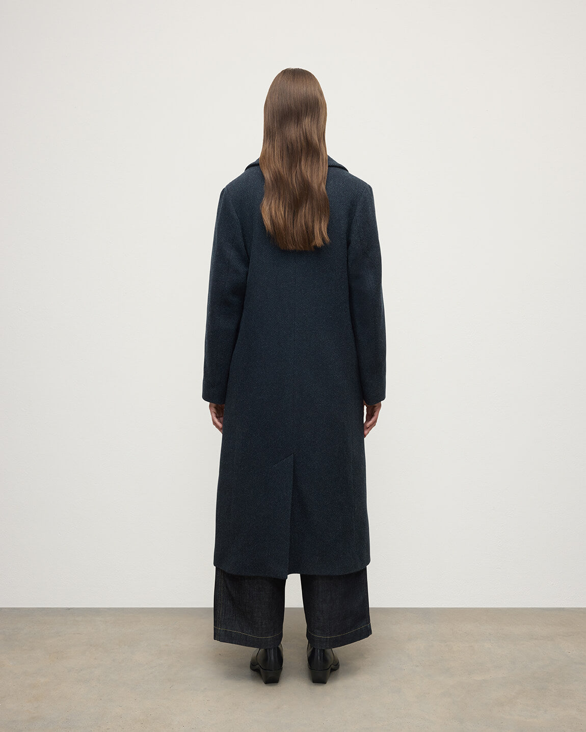 Model wearing Johnstons of Elgin AW25 Women's Tailoring Bottle Dark Twill The Great Coat in Green Back View TD000438RU7672