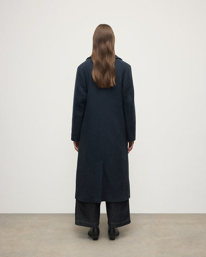 Model wearing Johnstons of Elgin  Women's Tailoring Bottle Dark Twill The Great Coat in Green Front View TD000438RU7672