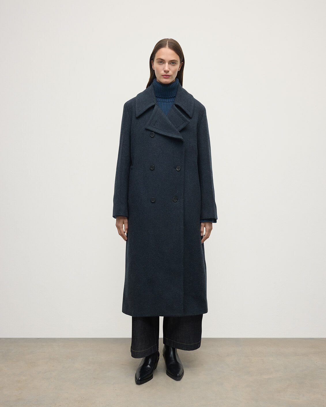 Model wearing Johnstons of Elgin AW25 Women's Tailoring Bottle Dark Twill The Great Coat in Green Front View TD000438RU7672