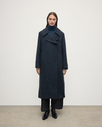 Model wearing Johnstons of Elgin  Women's Tailoring Bottle Dark Twill The Great Coat in Green Front View TD000438RU7672