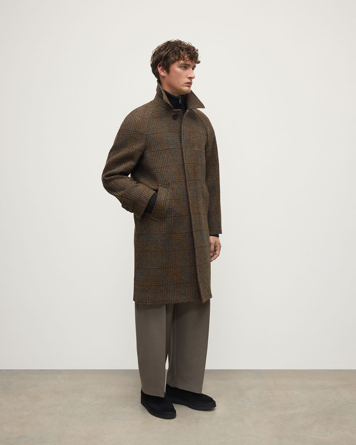 Model wearing Johnstons of Elgin AW25 Men's Tailoring Moorland Glen Urquhart Check The Balmacaan' Coat | Moorland Glen Urquhart Check Side  View TD000475RU7677