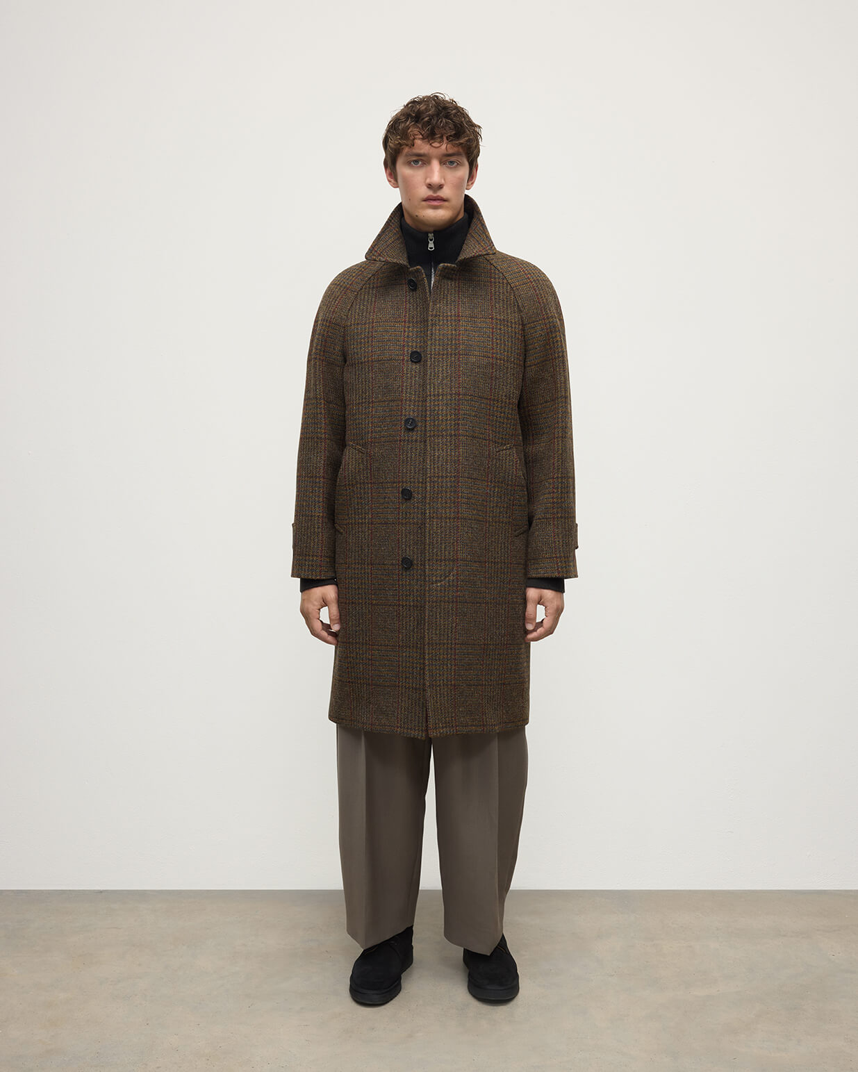 Model wearing Johnstons of Elgin AW25 Men's Tailoring Moorland Glen Urquhart Check The Balmacaan' Coat | Moorland Glen Urquhart Check Front View TD000475RU7677