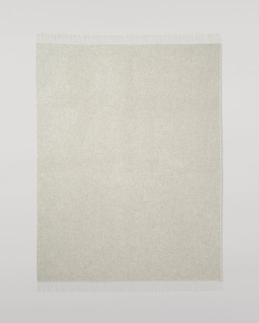 Johnstons of Elgin Interiors Collection Reversible Silver & White Cashmere Throw on a wooden chair WA000013RU5059ONE