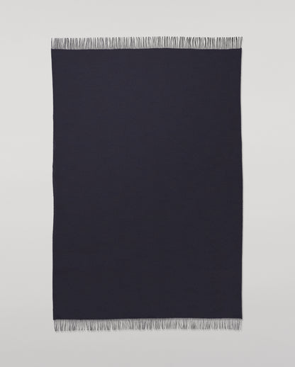 Johnstons of Elgin Interiors Collection  Reversible Navy & Light Grey Cashmere Throw on a wooden chair  WA000013RU6632N/A