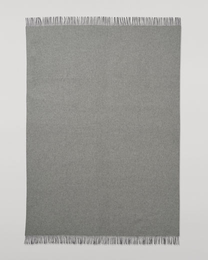 Johnstons of Elgin Interiors Collection  Reversible Navy & Light Grey Cashmere Throw on a wooden chair  WA000013RU6632N/A