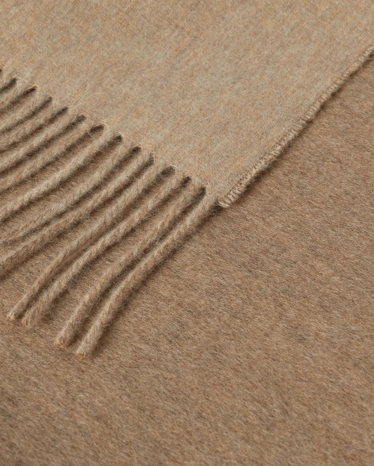 Johnstons of Elgin Interiors Collection Otter & Oatmeal Reversible Cashmere Throw on a grey background  WA000013RU7622ONE