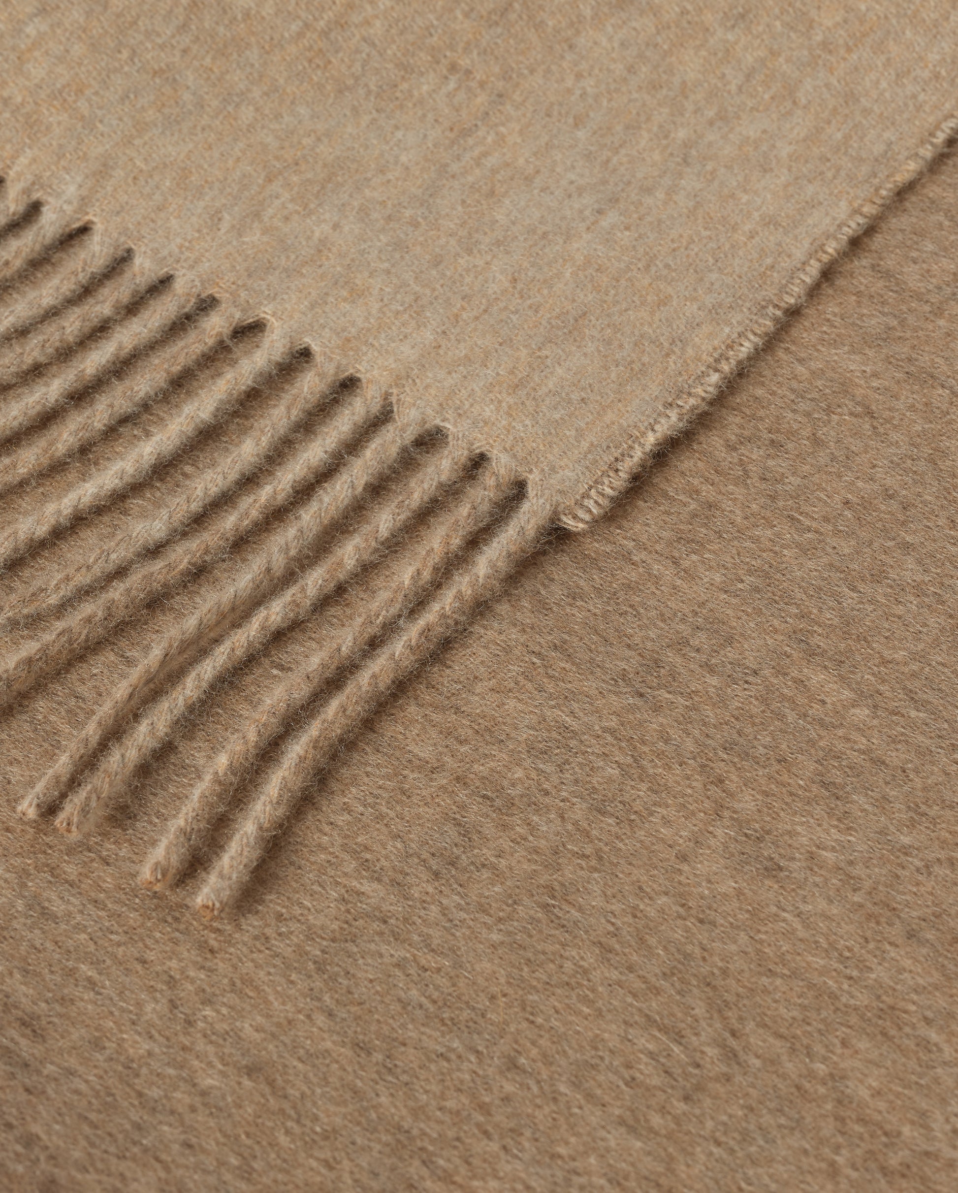 Johnstons of Elgin Interiors Collection Otter & Oatmeal Reversible Cashmere Throw on a grey background  WA000013RU7622ONE