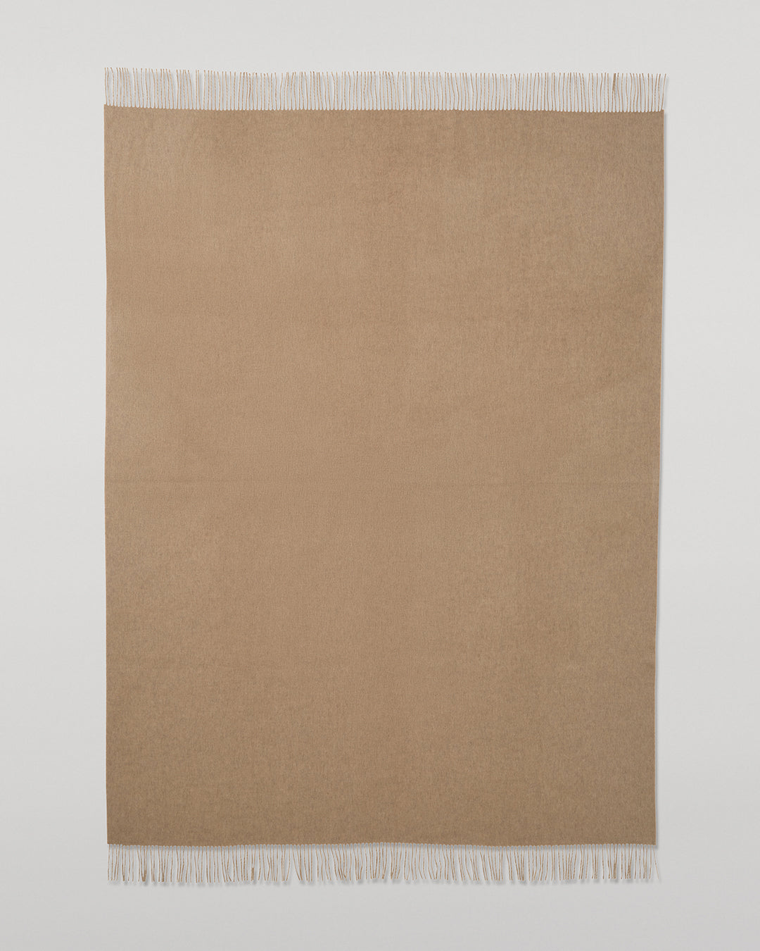 Johnstons of Elgin Interiors Collection Otter & Oatmeal Reversible Cashmere Throw on a grey background  WA000013RU7622ONE