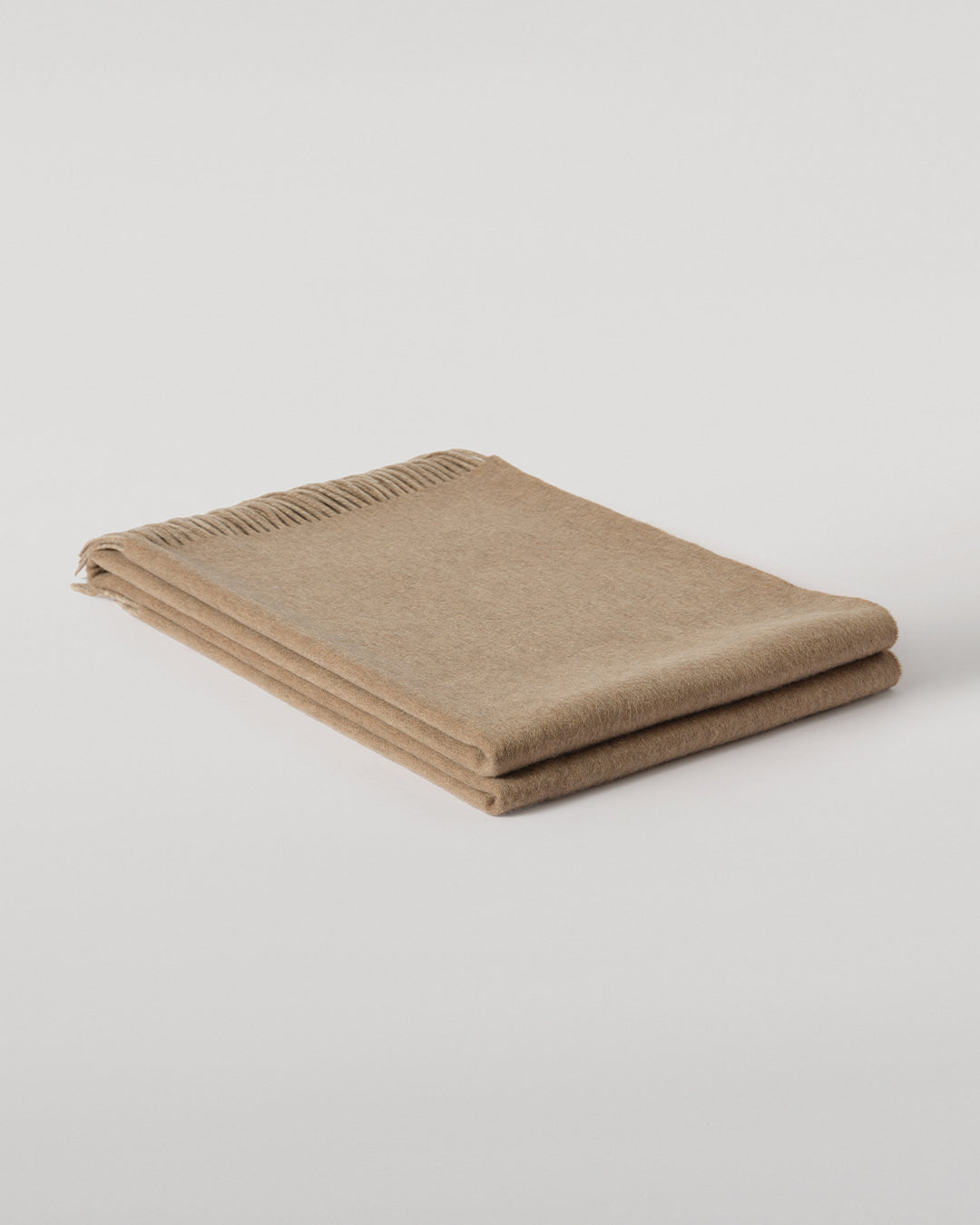 Johnstons of Elgin Interiors Collection Otter & Oatmeal Reversible Cashmere Throw on a grey background  WA000013RU7622ONE