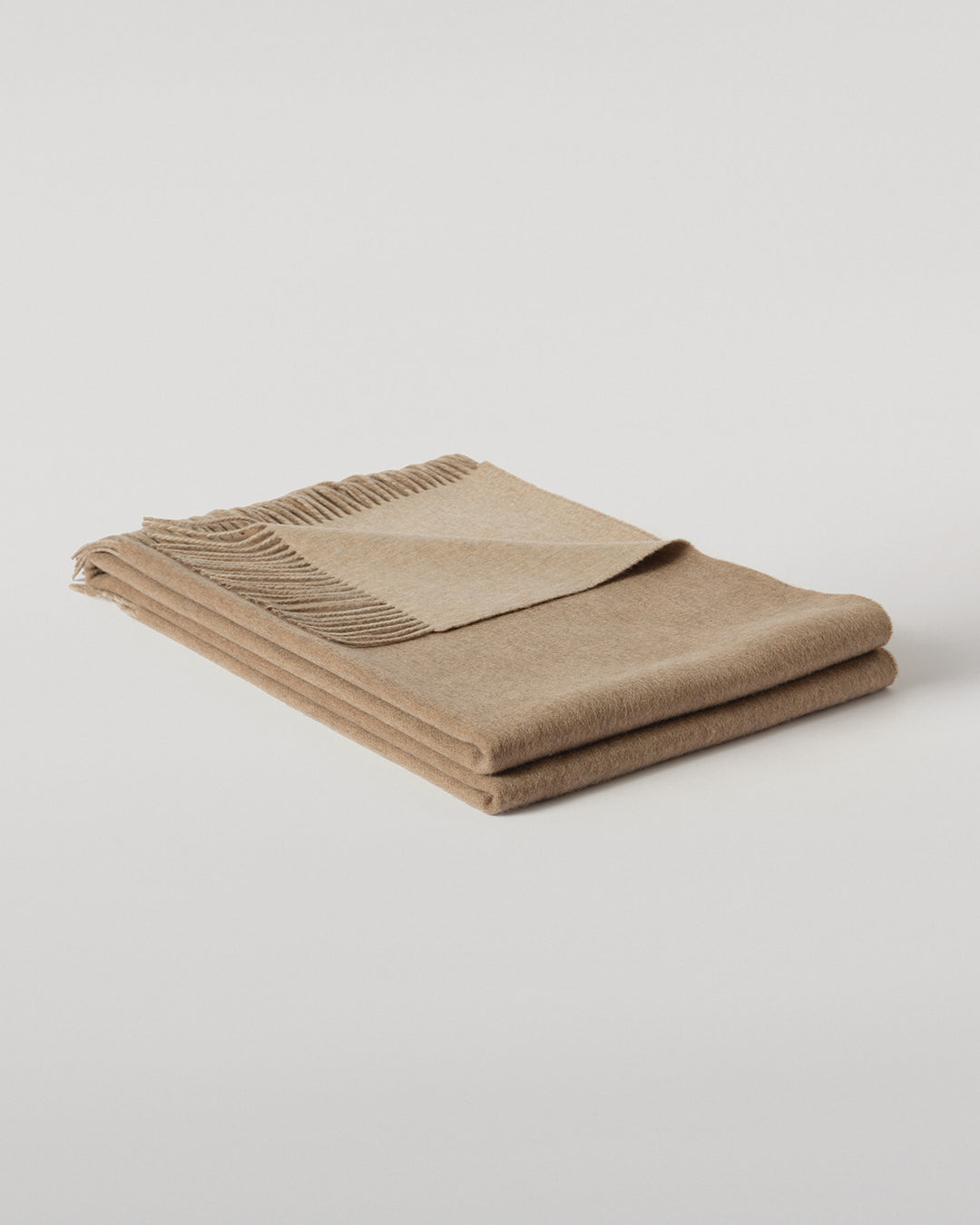 Johnstons of Elgin Interiors Collection Otter & Oatmeal Reversible Cashmere Throw on a grey background  WA000013RU7622ONE