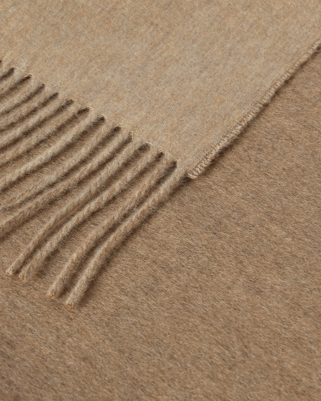 Johnstons of Elgin Interiors Collection Otter & Oatmeal Reversible Cashmere Throw on a grey background  WA000013RU7622ONE