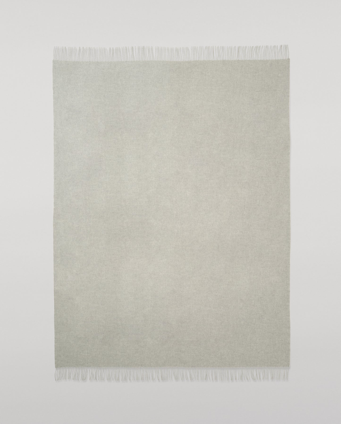 Johnstons of Elgin Interiors Collection  Silver Cashmere Throw on a wooden chair background  WA000055HA0100ONE