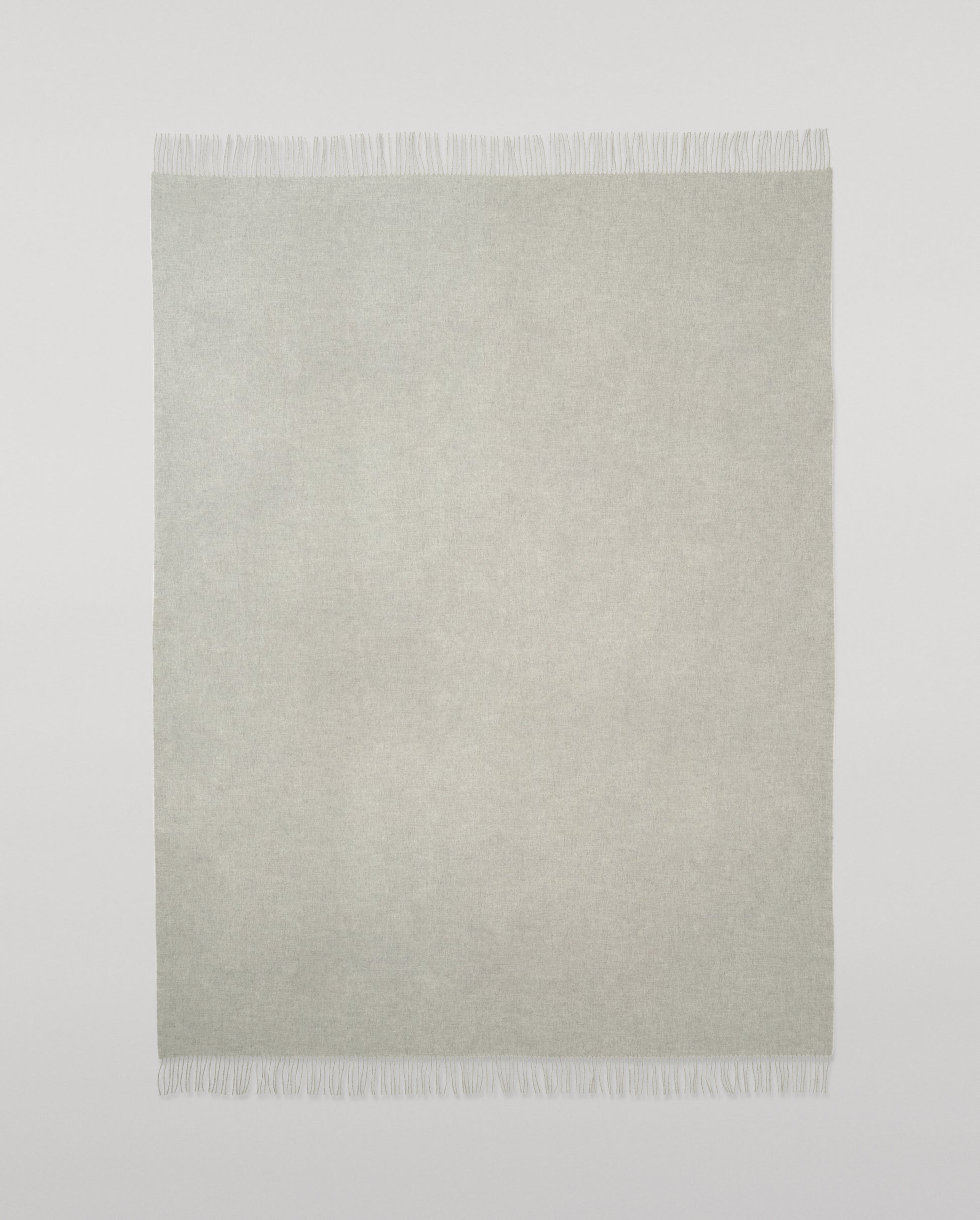 Johnstons of Elgin Interiors Collection  Silver Cashmere Throw on a wooden chair background  WA000055HA0100ONE